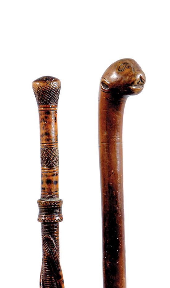 Appraisal: Two carved wood folk art walking canes late th century