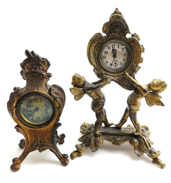 Appraisal: CLOCKS Two small gilt cast-metal wind-up desk clocks the first