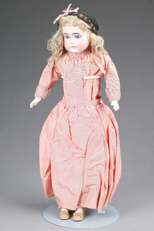 Appraisal: DOLL Shouldered bisque head and hands and glass eyes in