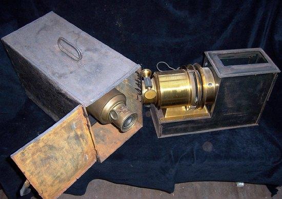 Appraisal: A magic lantern in tin box and another