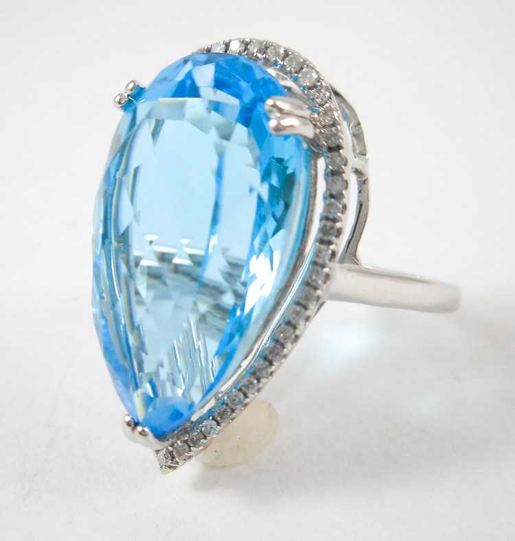 Appraisal: BLUE TOPAZ DIAMOND AND FOURTEEN KARAT GOLD RING The white