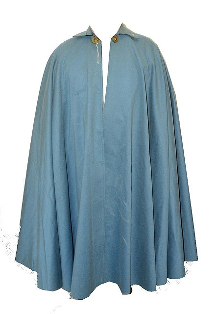 Appraisal: A 'NAPOLEONIC' BLUE SERGE CAPE with silver star ornament and