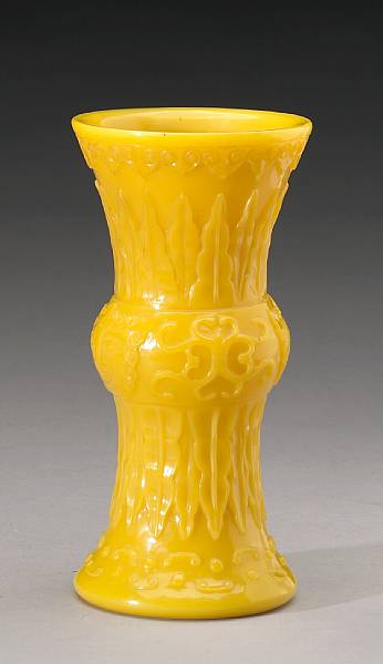 Appraisal: A yellow glass gu form vase The central bulb sandwiched