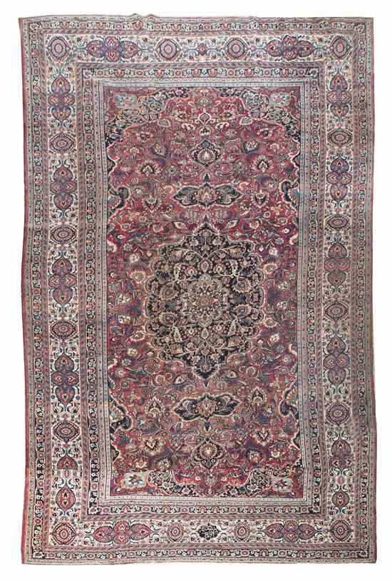 Appraisal: A Keshan Wool Rug centered with a floral medallion on