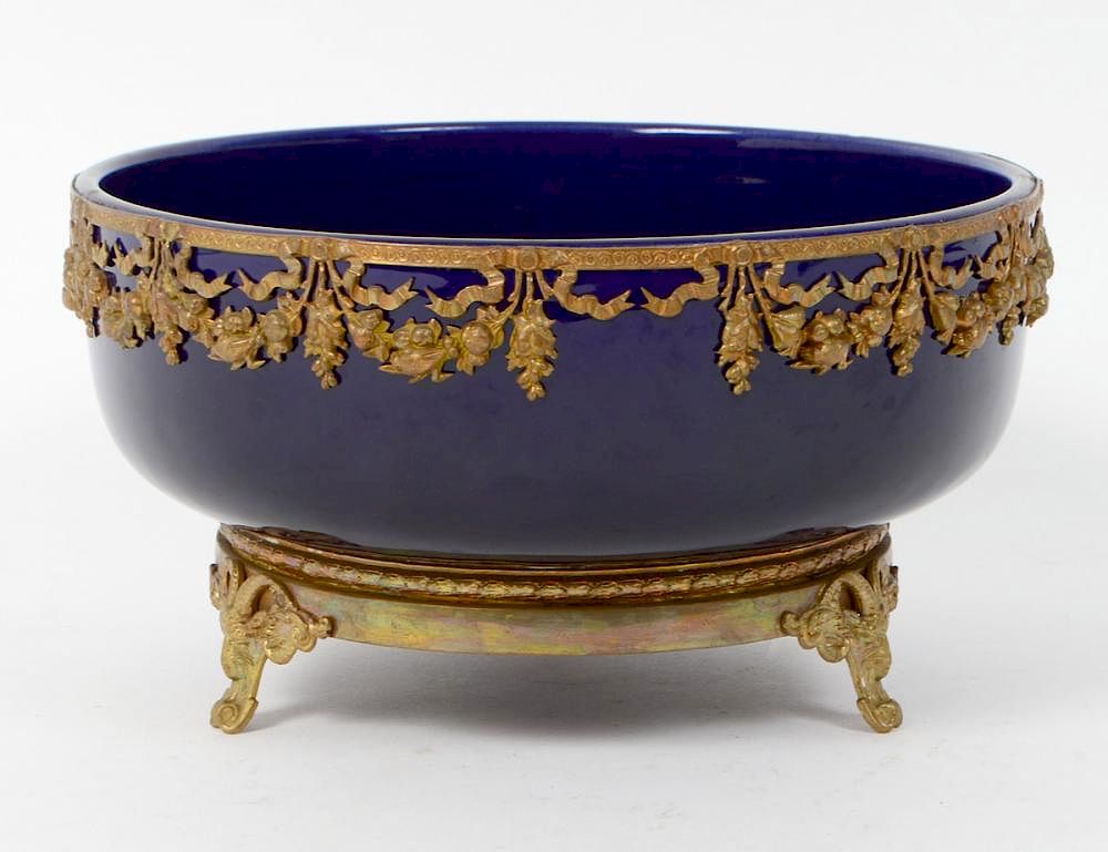 Appraisal: FRENCH GILT METAL MOUNTED BLUE GLAZED BOWL Early th Century