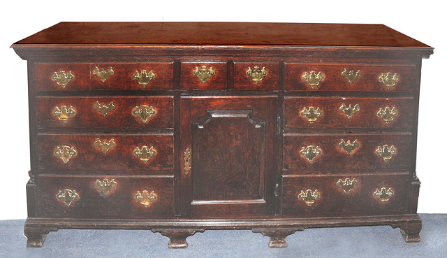 Appraisal: A GEORGE III NORTH COUNTRY OAK DRESSER fitted a central