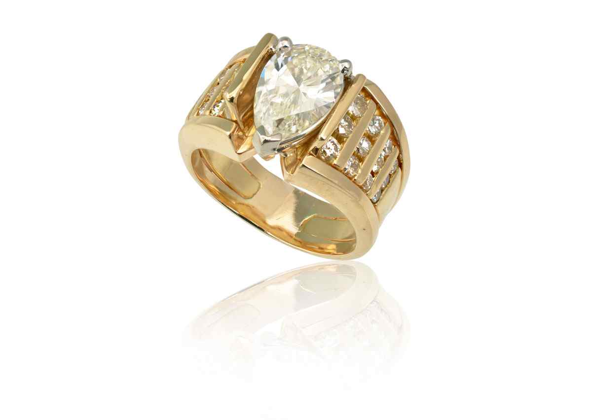 Appraisal: CT PEAR SHAPED DIAMOND RING K yellow gold ring centers