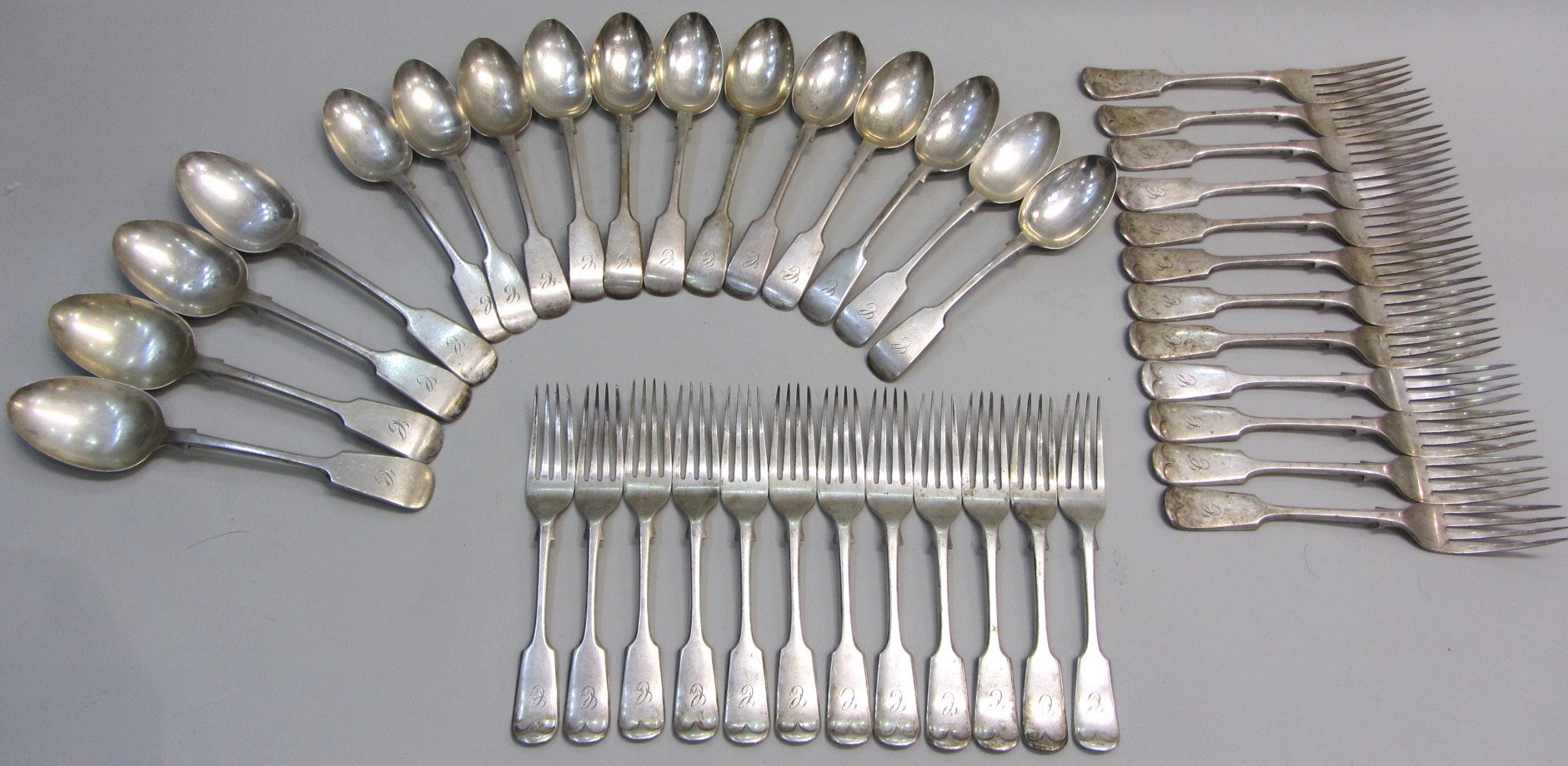 Appraisal: A silver fiddle pattern part table service comprising twelve dessert