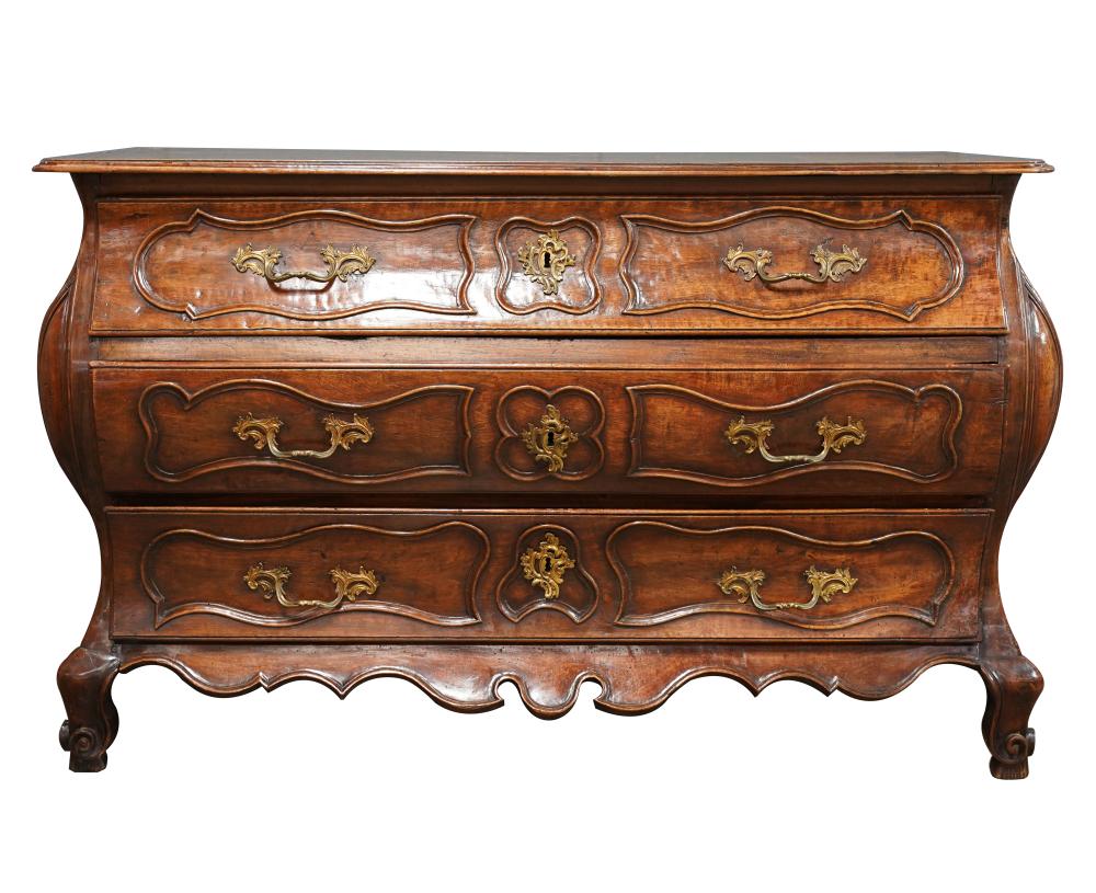 Appraisal: FRENCH PROVINCIAL WALNUT BOMBE COMMODE th early th century with