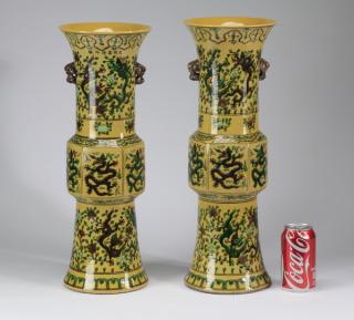 Appraisal: Chinese dragon motif Gu vases h Pair of Chinese yellow