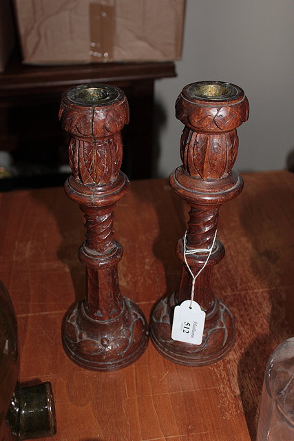 Appraisal: A PAIR OF OAK CANDLESTICKS with acanthus leaf carved barley