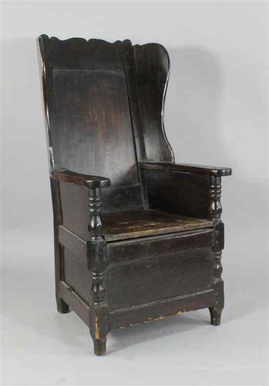 Appraisal: An early th century provincial stained pine lambing chair with