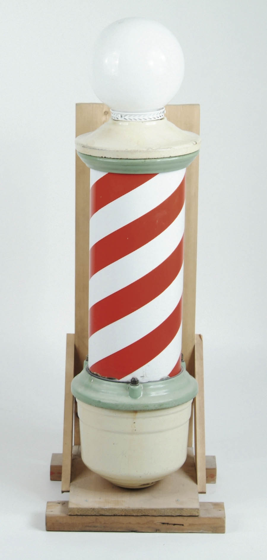 Appraisal: ELECTRIFIED PORCELAIN BARBER POLE Wall-mounted barber pole in a lime