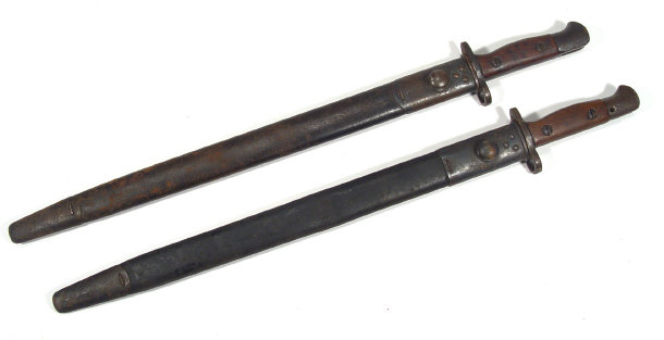 Appraisal: Two military steel bladed bayonets and scabbards each cm in