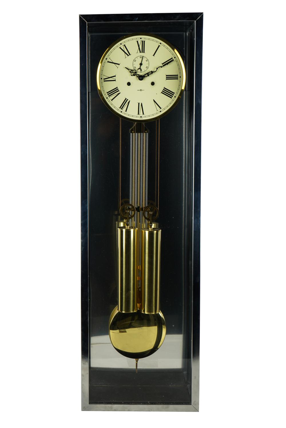 Appraisal: HOWARD MILLER CHROME CASE WALL CLOCKwith two weights and pendulum