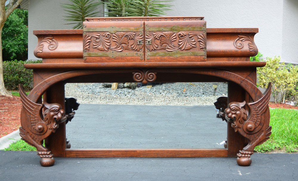 Appraisal: CARVED GRIFFIN OVER MANTLE MIRROR Ball gallery over doors with