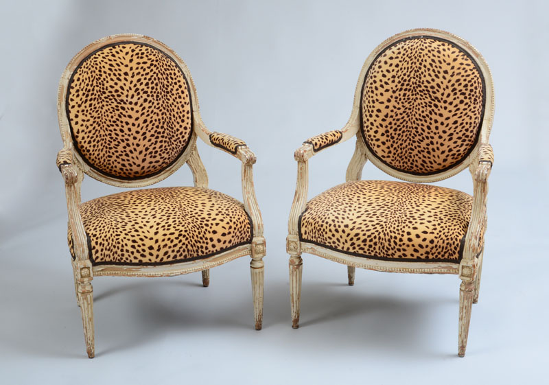 Appraisal: PAIR OF LOUIS XVI STYLE CREAM PAINTED FAUTEUILS LA REINE