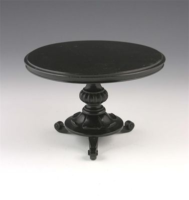 Appraisal: A Victorian apprentice piece ebonised centre table with a circular