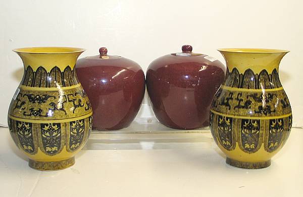 Appraisal: Four glazed porcelain vessels Including a pair of yellow biscuit