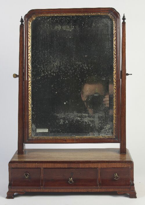 Appraisal: A George II mahogany dressing mirror the bevelled rectangular mirror