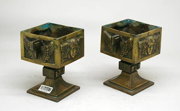 Appraisal: A pair of Art Deco bronze two handled pedestal jardinieres