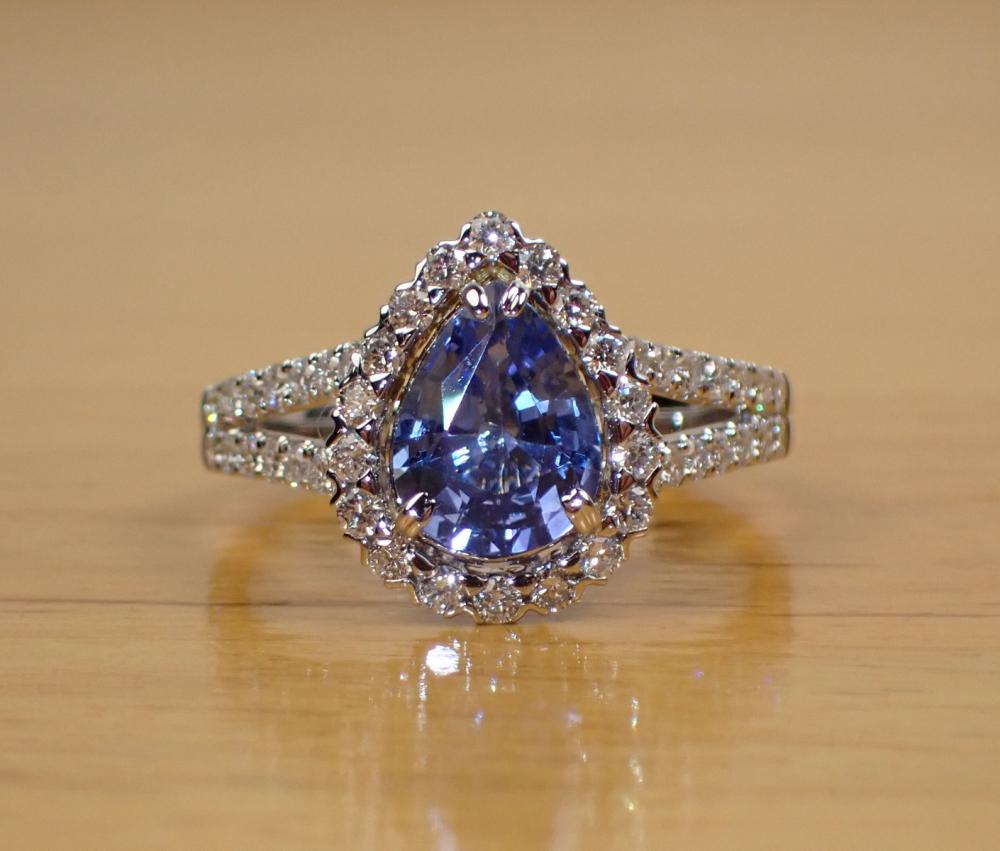 Appraisal: SAPPHIRE DIAMOND AND FOURTEEN WHITE GOLD RING with round-cut diamonds