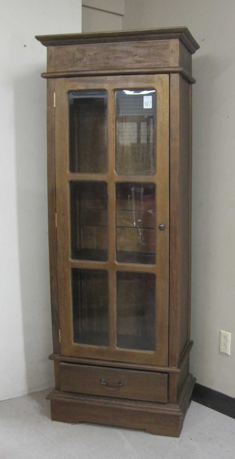 Appraisal: SINGLE DOOR DISPLAY CABINET antique reproduction with two interior wood