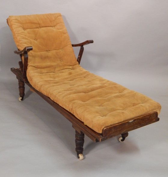 Appraisal: A thC walnut campaign style day bed with part caned