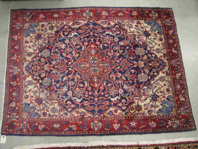 Appraisal: Sarouk Persian Handmade Rug elaborate floral red blues ivory '