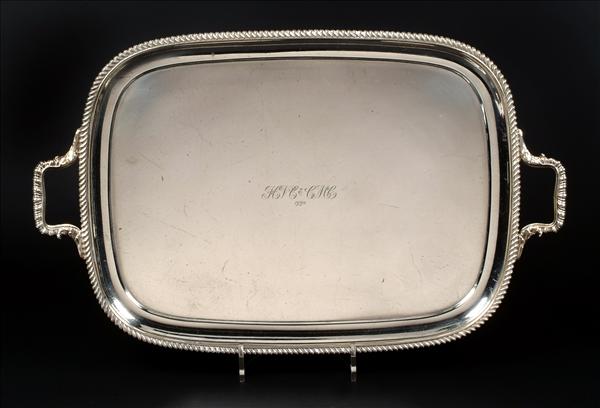 Appraisal: A silver oblong twin handled tray by Harrods Ltd Richard