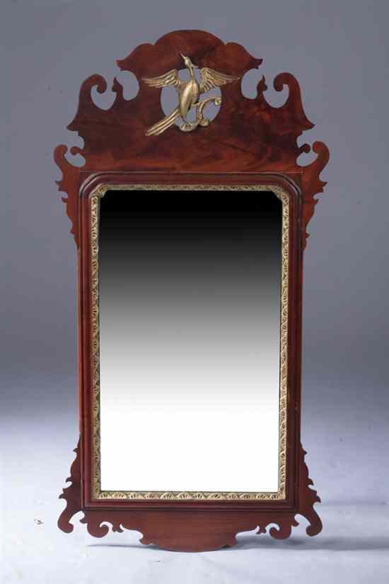 Appraisal: CHIPPENDALE MAHOGANY AND PARCEL-GILT LOOKING GLASS Late th century Scrolling