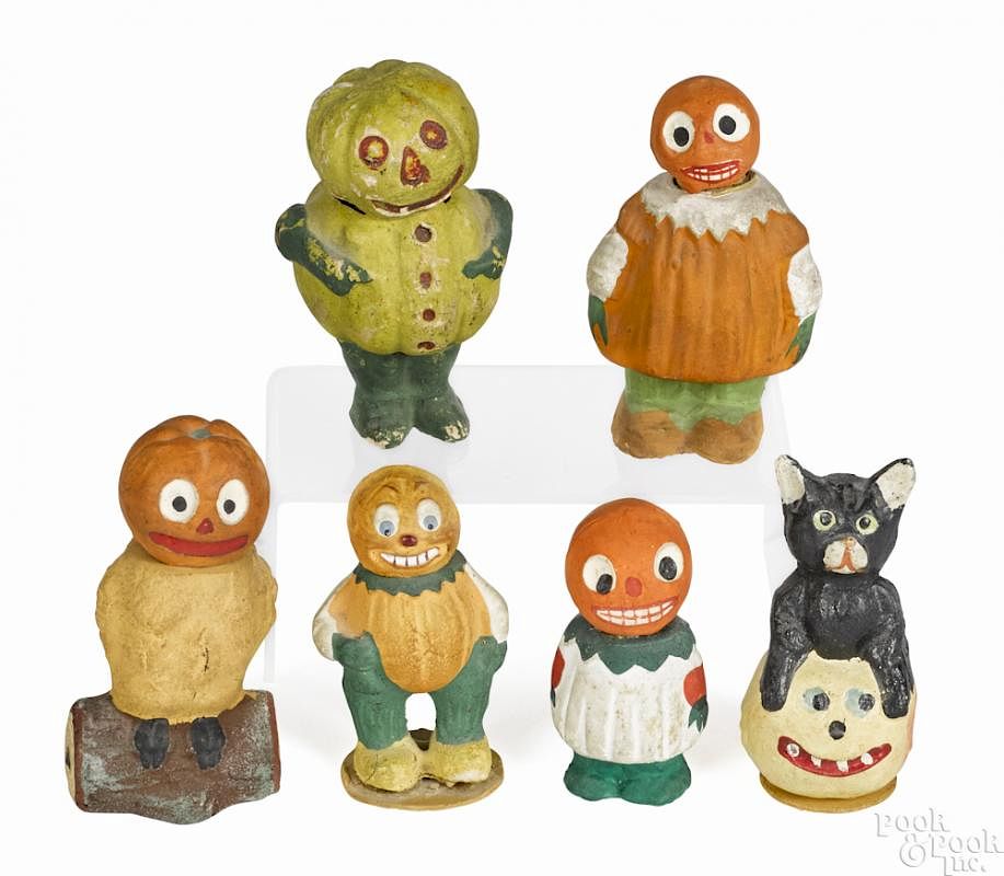 Appraisal: Six German composition Halloween candy containers to include a pumpkin