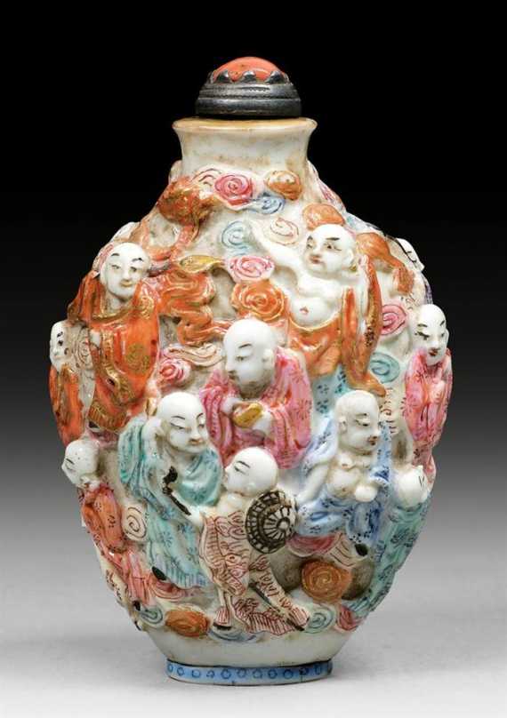 Appraisal: PORCELAIN SNUFFBOTTLE WITH MOULDED DESIGN OF THE LUOHAN China first