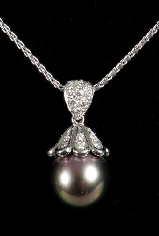 Appraisal: Mikimoto platinum diamond and black pearl pendant suspended from a