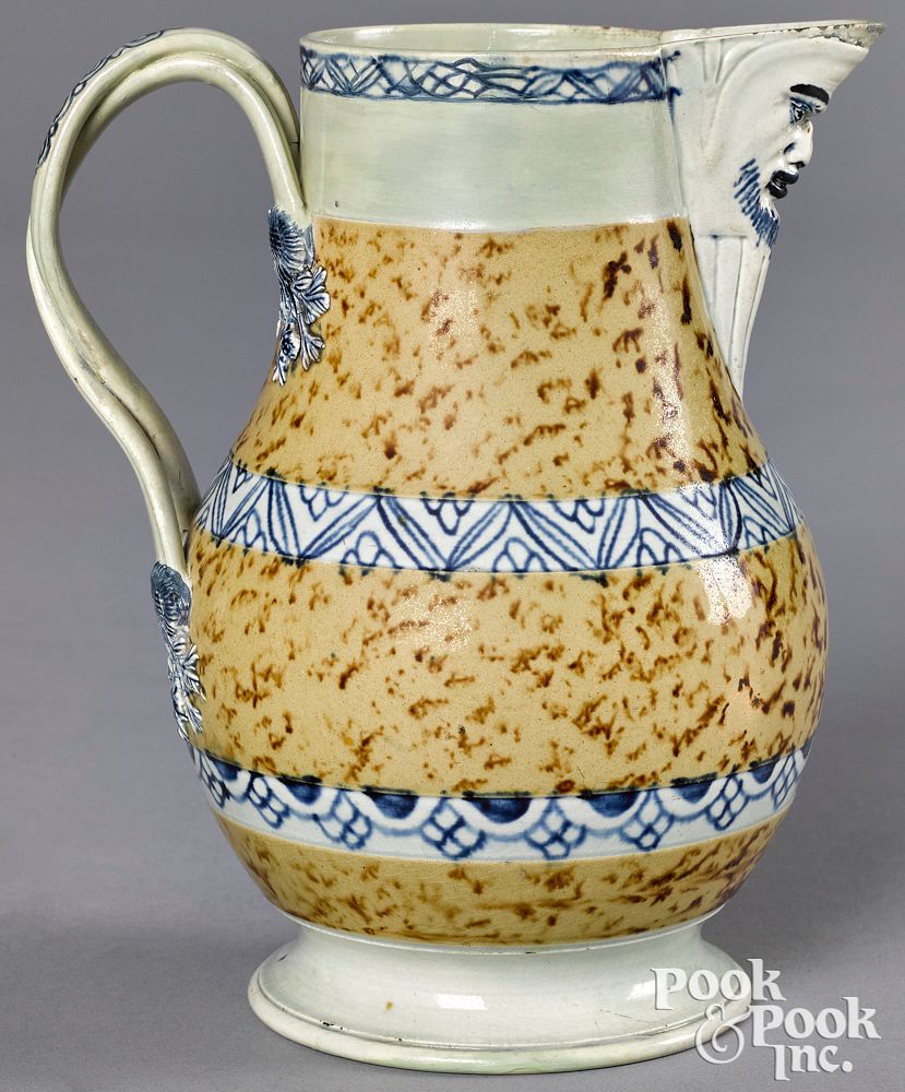 Appraisal: Mocha pitcher Mocha pitcher with brown speckled glaze and blue