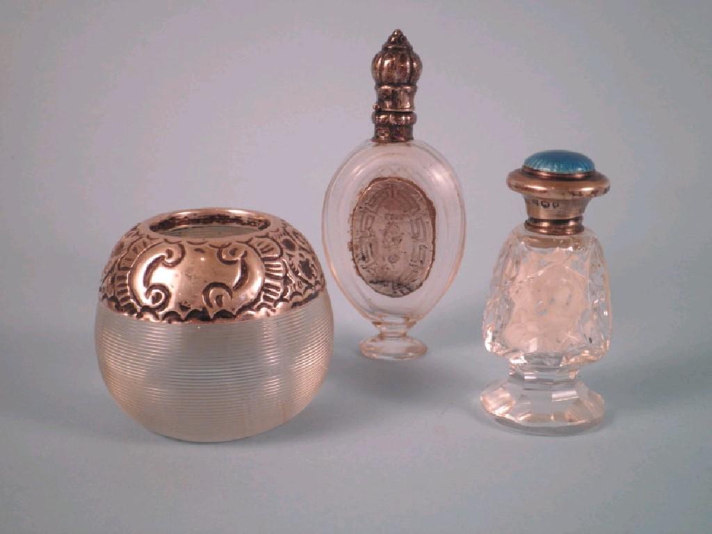 Appraisal: A cut glass scent bottle with silver mount decorated with