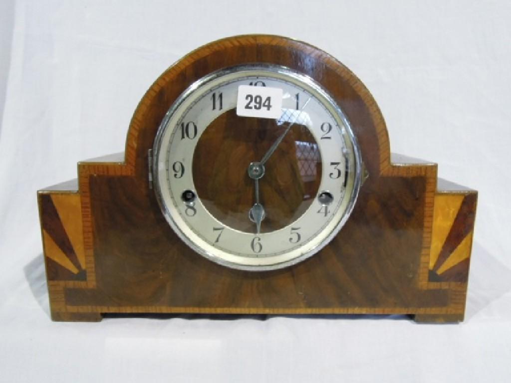 Appraisal: An Art Deco mantle clock in walnut with chrome detail