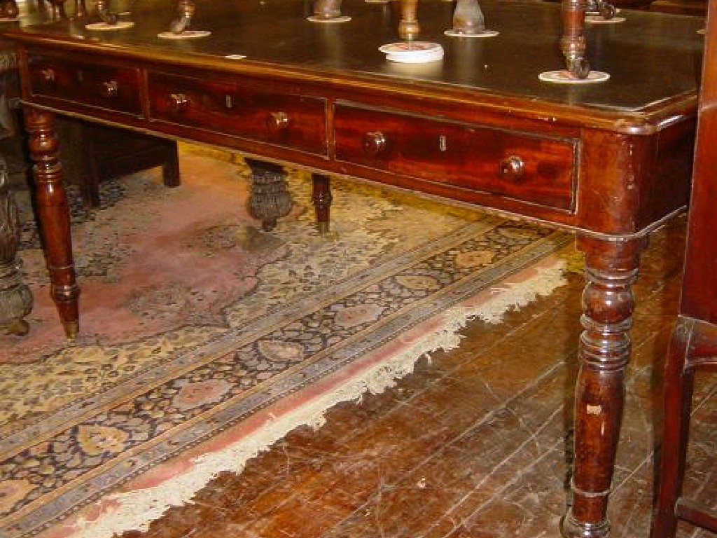 Appraisal: A th century mahogany partners table with inset leather top