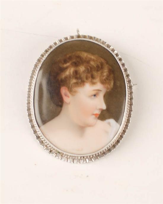 Appraisal: A Handpainted Portrait on Porcelain Brooch the portrait of a