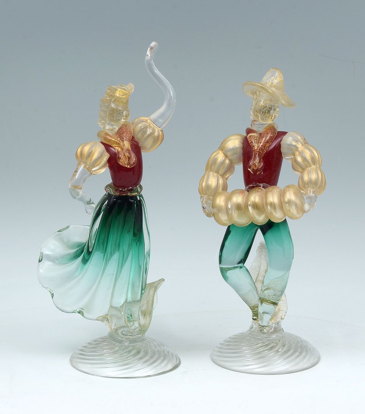 Appraisal: VENETIAN GLASS DANCING FIGURES Mid-century Male Female Venetian dancing figures