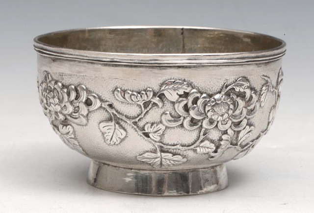 Appraisal: A CHINESE SILVER BOWL on pedestal foot with embossed chrysanthemum