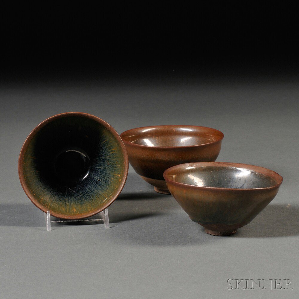 Appraisal: Three Northern Black-ware Tea Bowls with Indented Lips China possibly