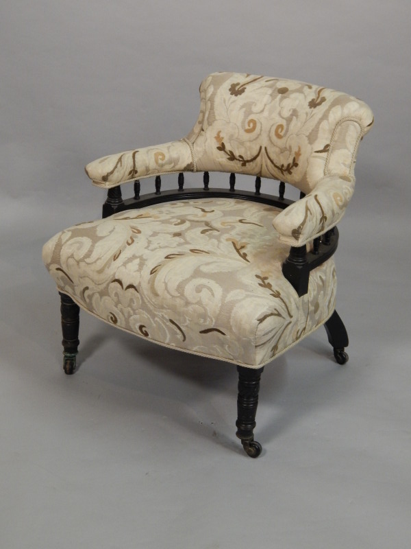 Appraisal: A Victorian ebonised tub shaped chair re-upholstered in modern fabric