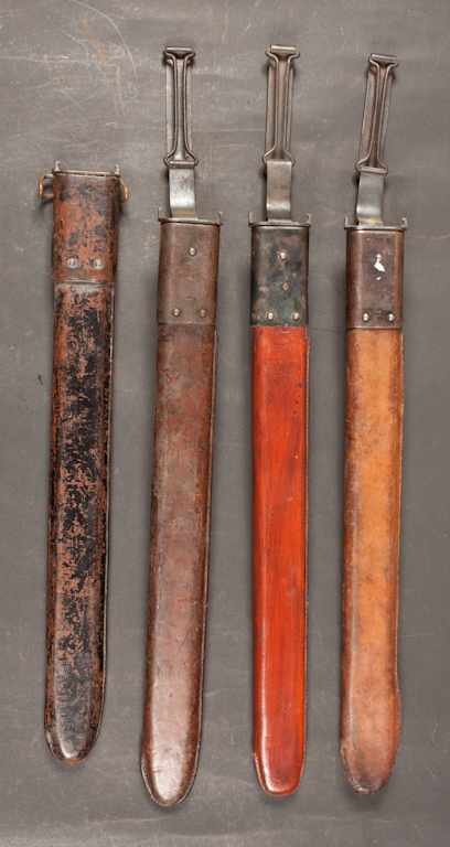 Appraisal: Four scabbards circa three with waist belt swivel arms and