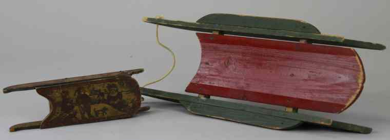 Appraisal: TWO EARLY WOODEN SLEDS Small wood sled that serves as