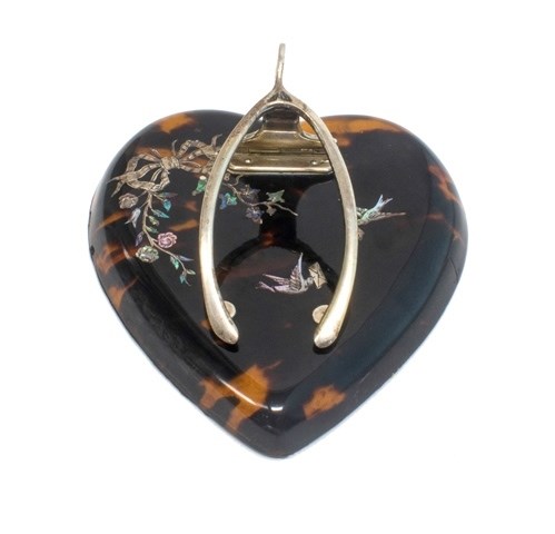 Appraisal: A silver mounted tortoiseshell heart shaped letter clip formed as