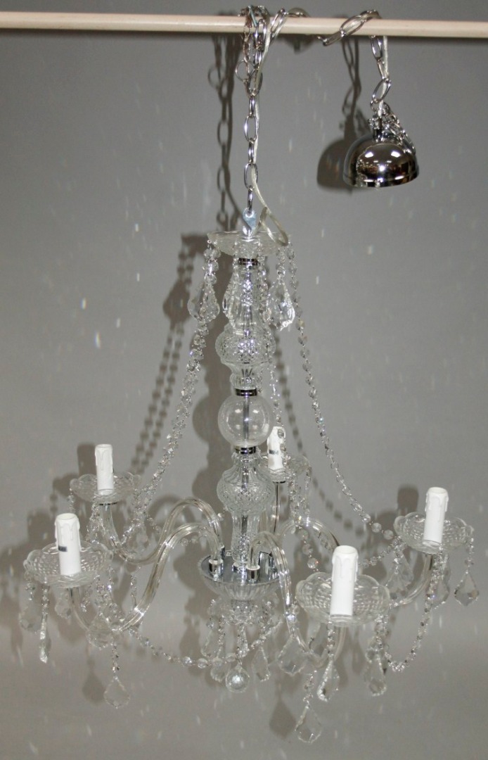 Appraisal: A modern five branch moulded glass chandelier suspended with various