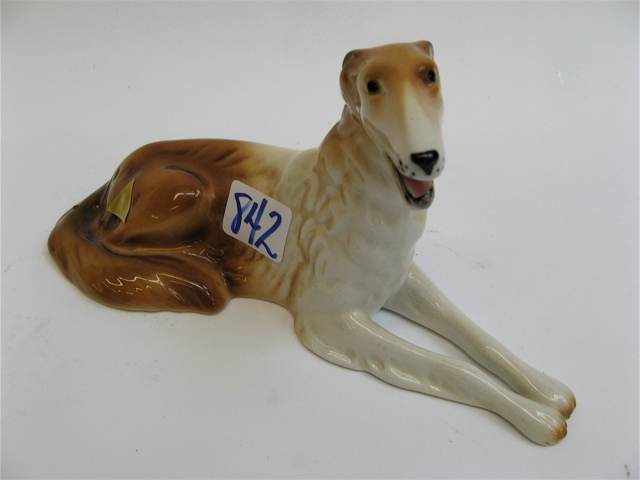 Appraisal: ROYAL DUX GLAZED PORCELAIN FIGURE OF A DOG brown and