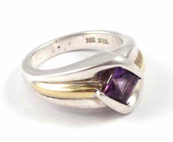 Appraisal: AMETHYST SILVER AND YELLOW GOLD RING The k yellow gold