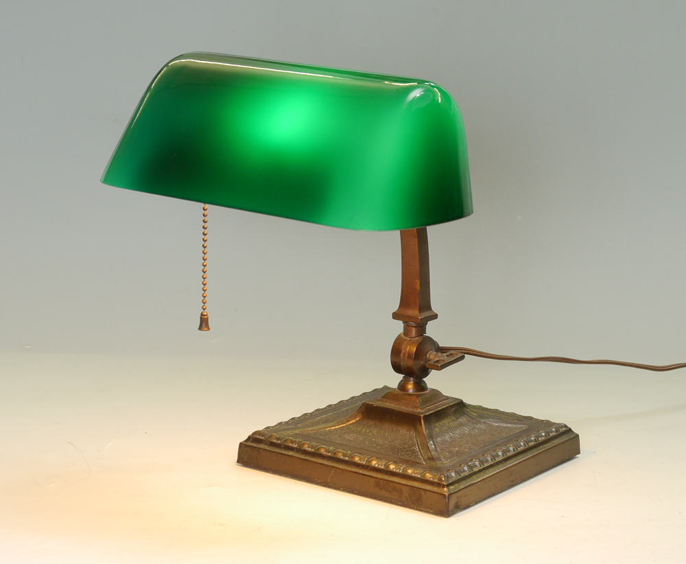 Appraisal: AMRONLITE CASED GREEN SHADE DESK LAMP Heavy cast metal base